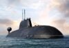 A large submarine emerging from the water against a cloudy sky