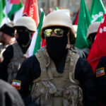 IRAN CHAOS: Protests Spread to 110 Cities Soldiers in formation with flags and helmets visible