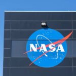 Exoplanet Surprise: First-Ever Glimpse of Life? NASA logo displayed on a building against a clear blue sky