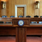 United States Senate hearing room with empty chairs